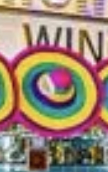 Brightly coloured Mexican-style sombrero featuring concentric rings of vibrant yellow, green, and pink fabric.