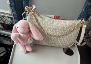 Lost Michael Kors handbag featuring a pink bunny keychain